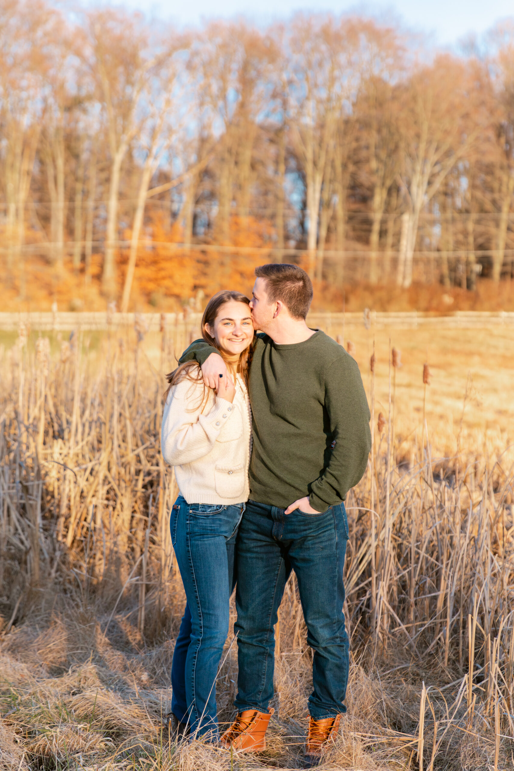 Couple posing in a field of phragmites 