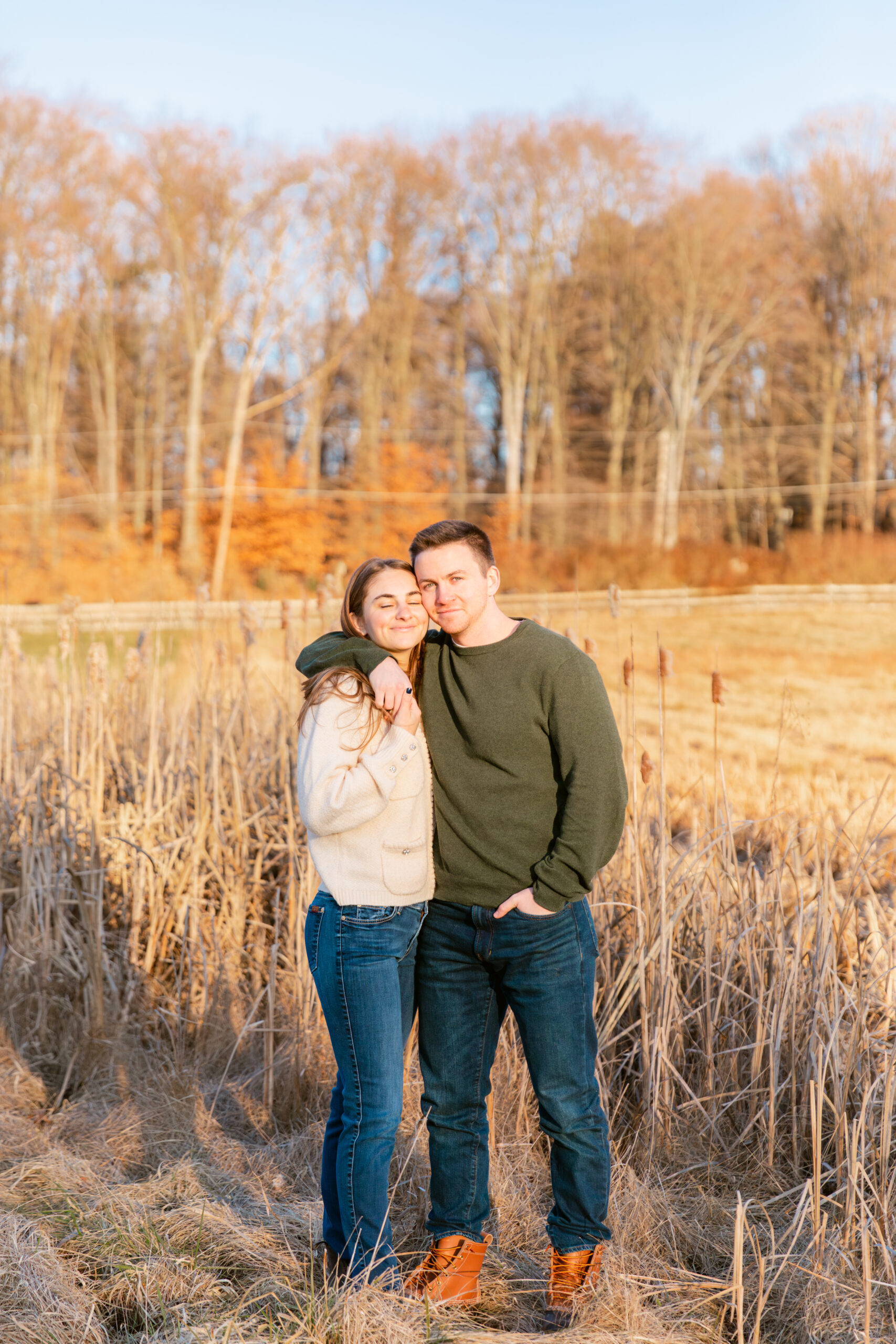 Couple posing in a field of phragmites 