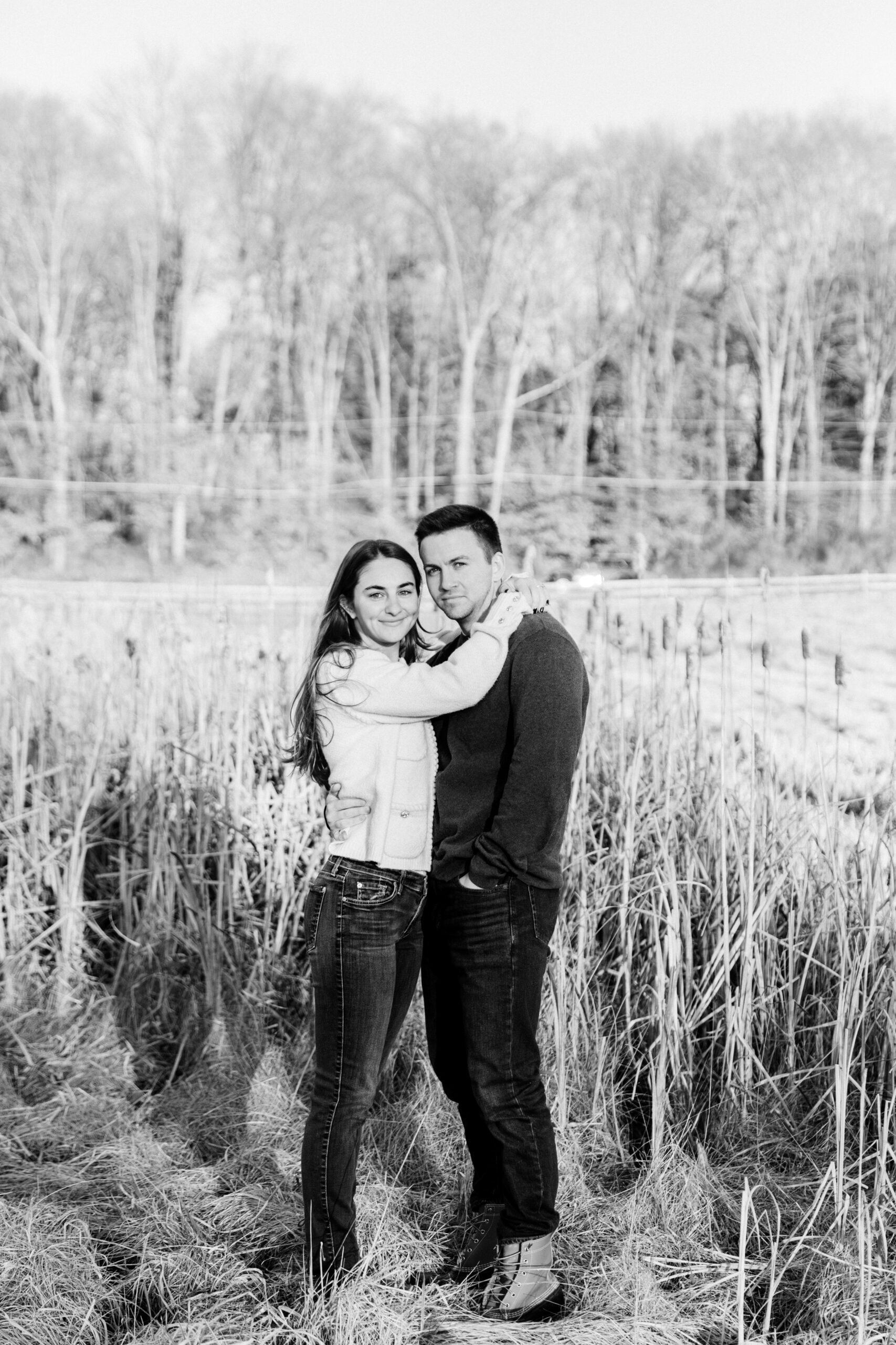 Couple posing in a field of phragmites 