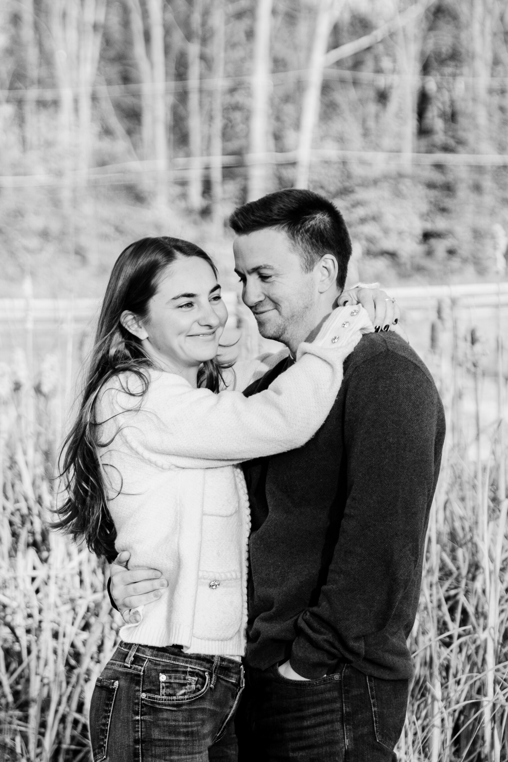 Couple posing in a field of phragmites 