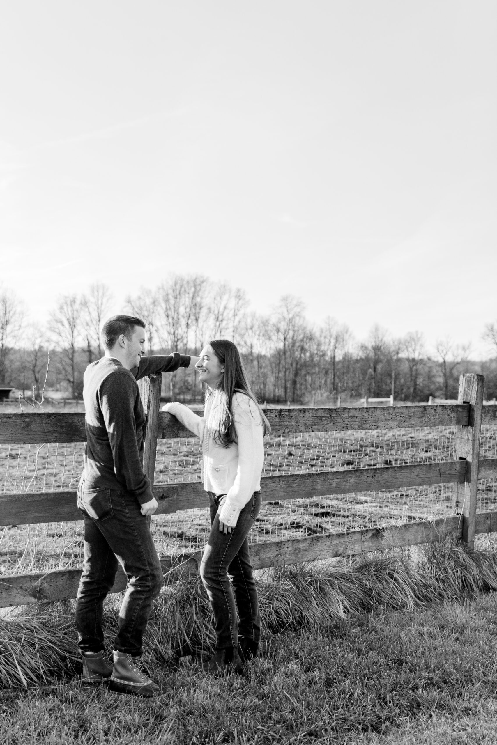 Couple posing on a fence