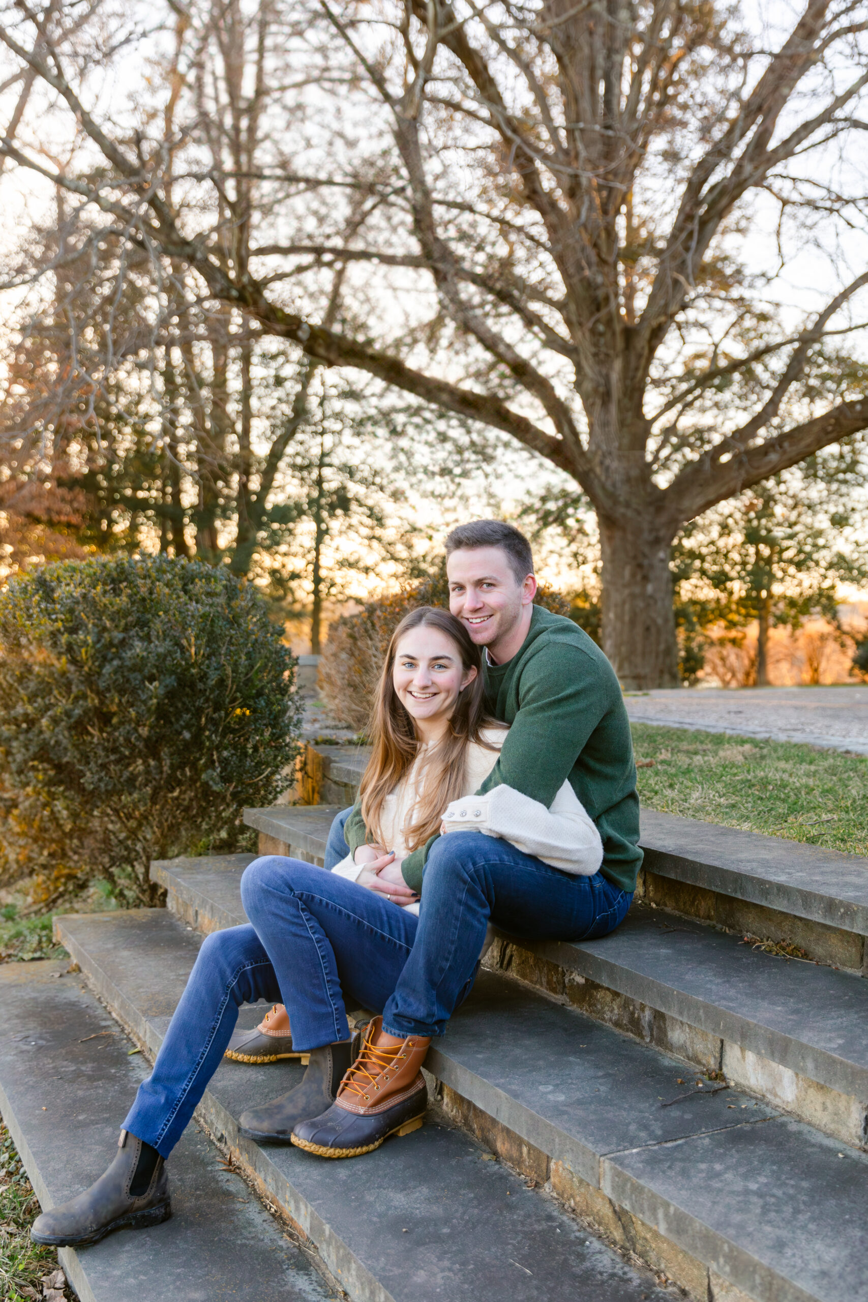 Couple sitting on stairs with sunset