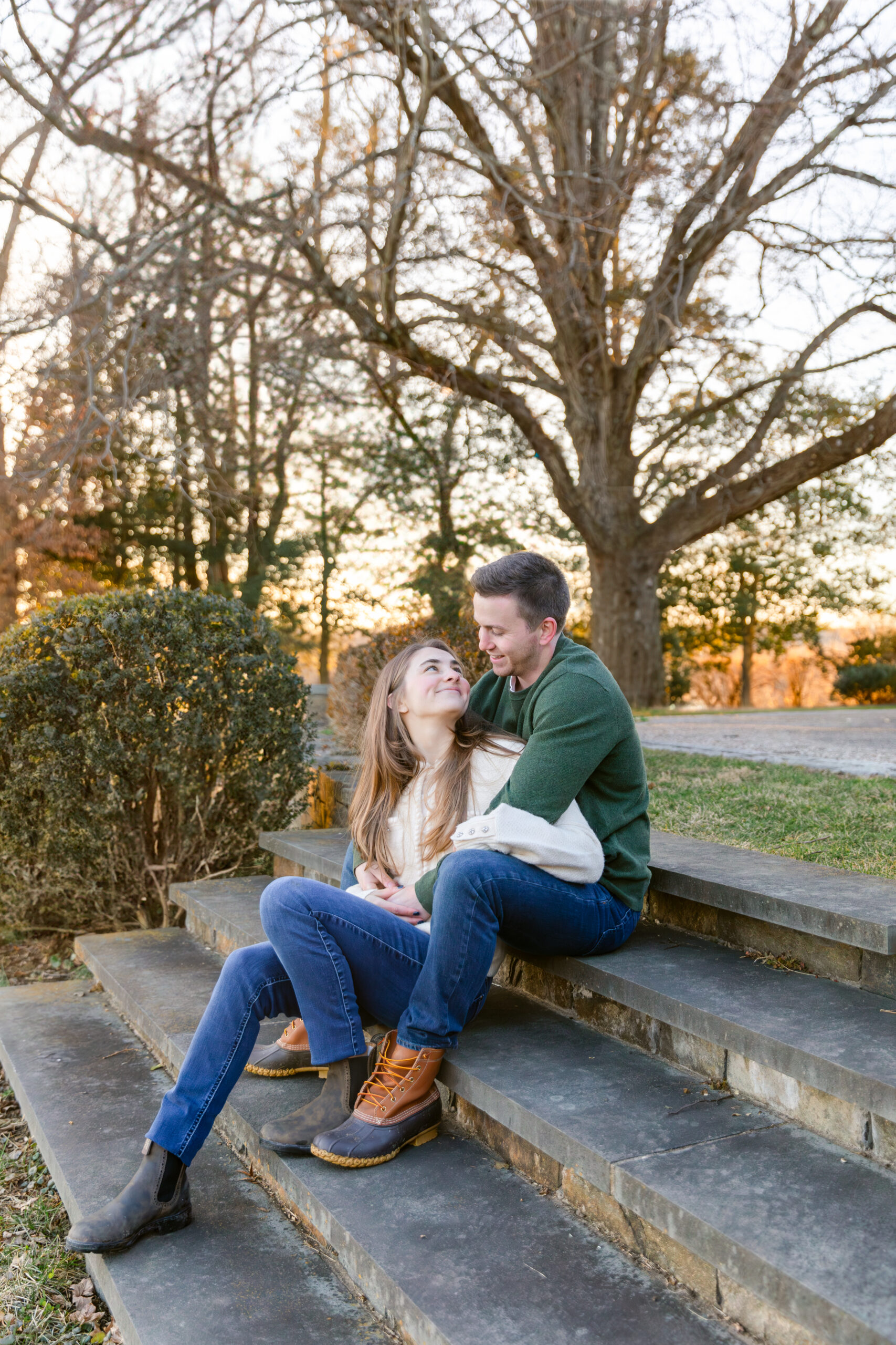 Couple sitting on stairs with sunset