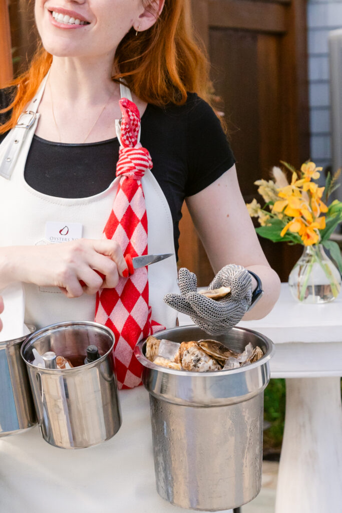 girl shucking oysters