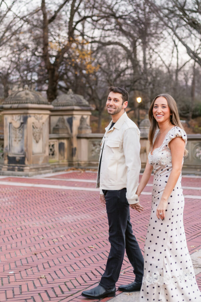 Couple walking and posing in central park