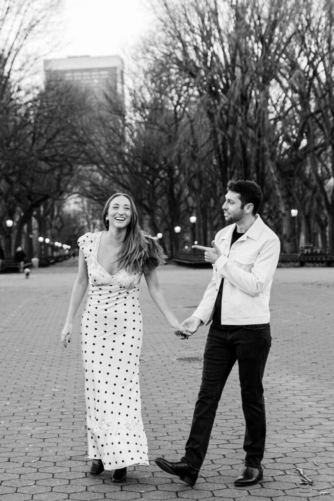 Couple twirling at the central park mall