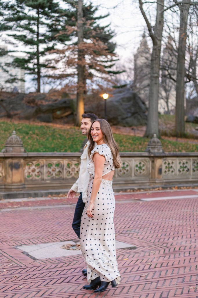 Couple walking and posing in central park