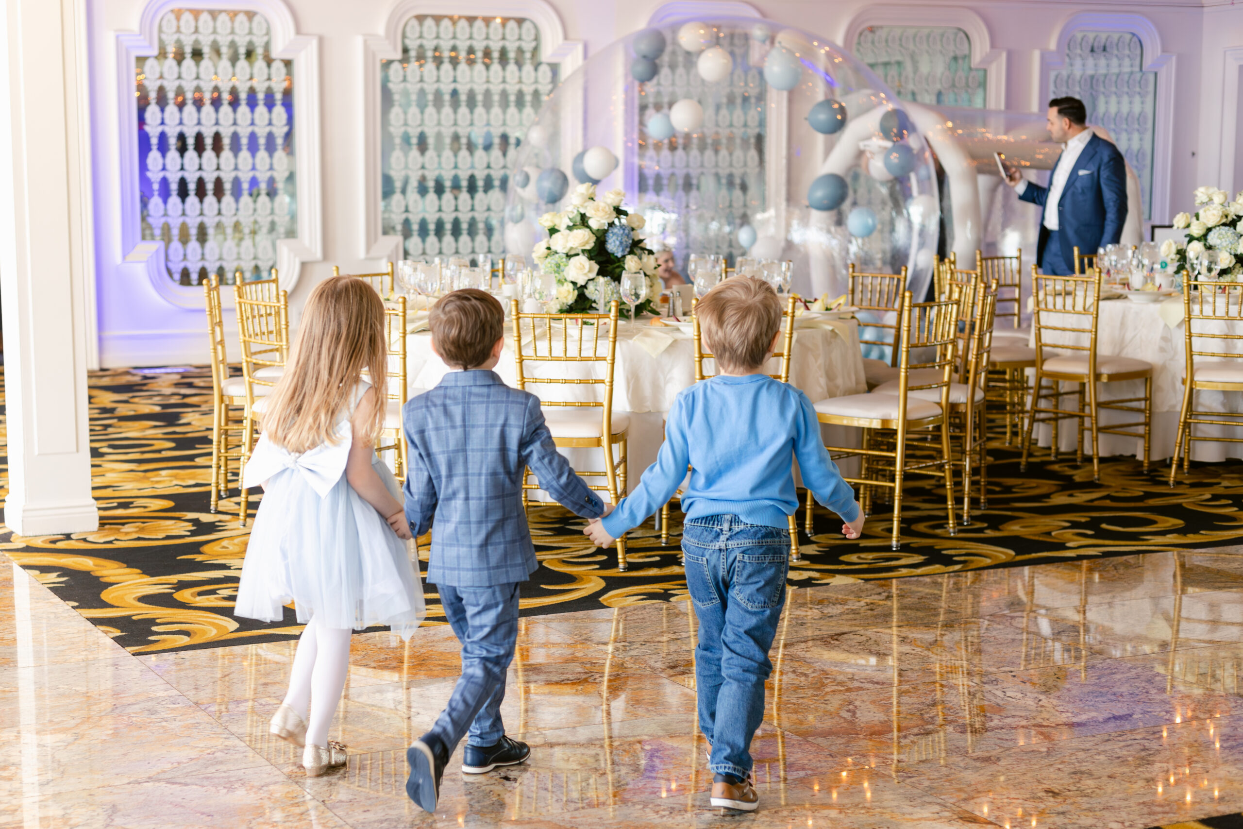 Westmount Country Club Kids holding hands at baptism reception