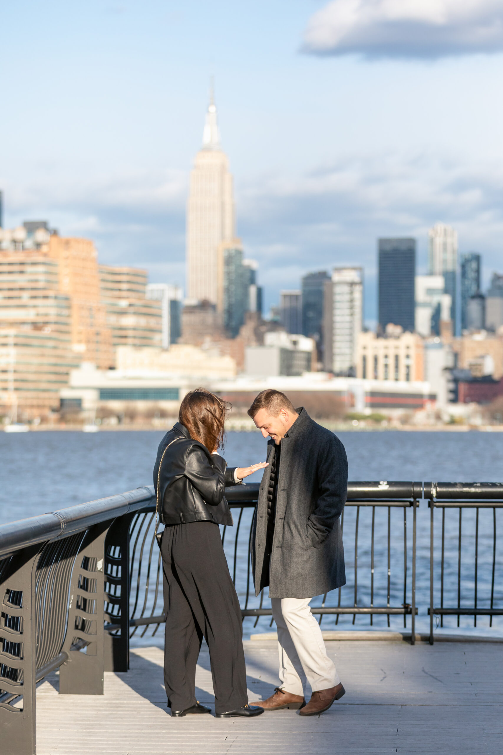 Newly engaged couple at the hoboken waterfront