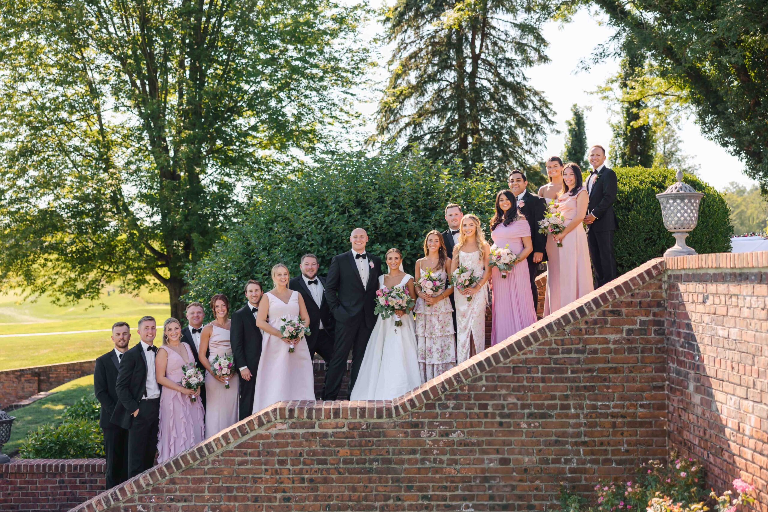 wedding party on stairs at hamilton farm new jersey