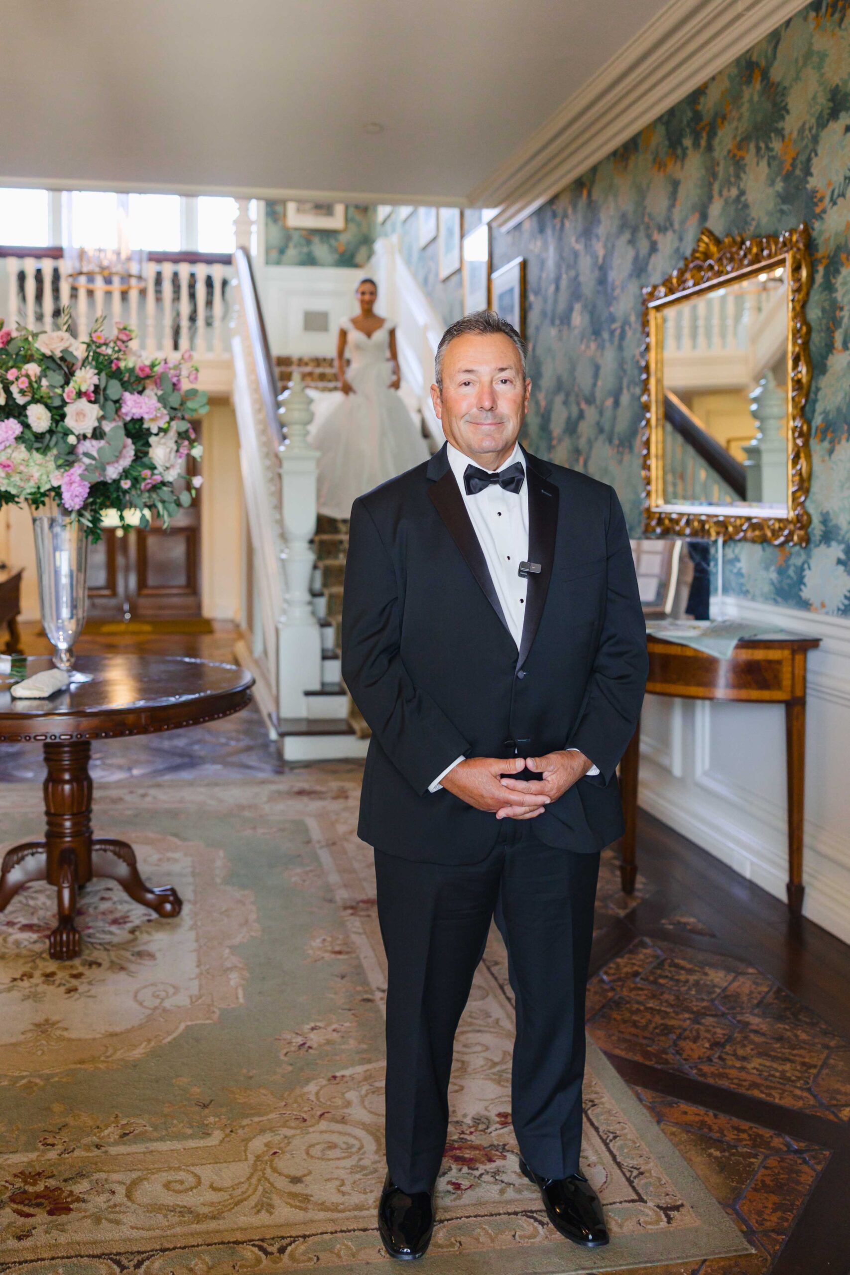Bride walking downstairs for Father daughter first look